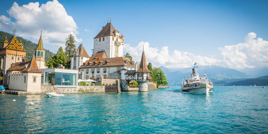 Sailing across the glistening waters of Lake Thun